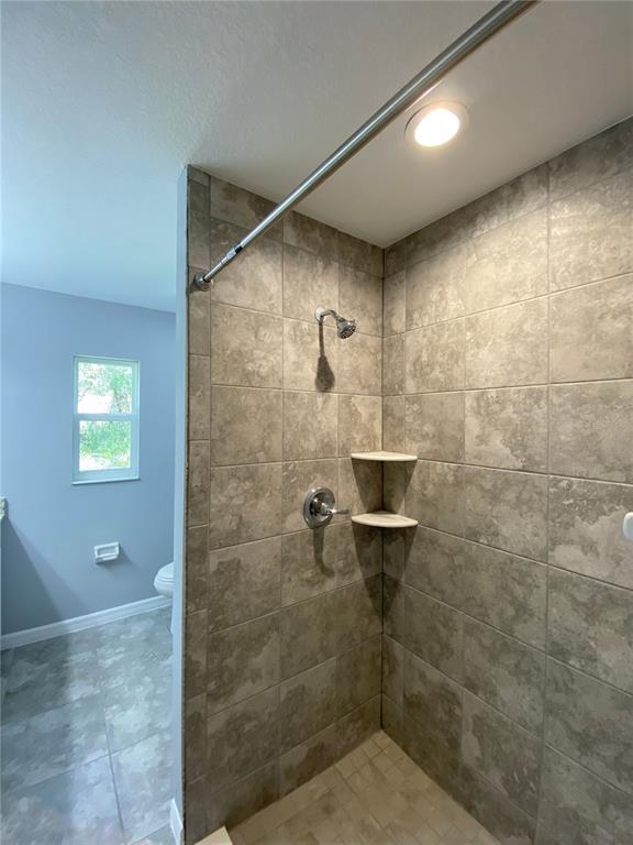 2458 Southwest 170th Loop Ocala, FL 34473 - Photo 17 of 25 a bathroom with a shower