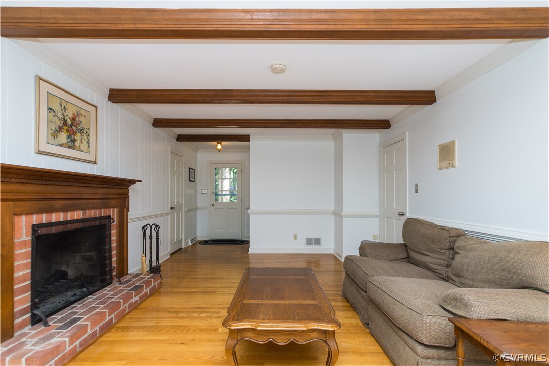 1971 Castlebridge Road Midlothian, VA 23113 - Photo 6 of 29 a living room with a couch and a fireplace