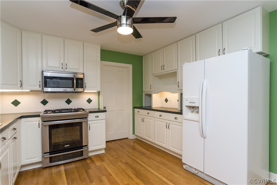 1971 Castlebridge Road Midlothian, VA 23113 - Photo 10 of 29 a kitchen with stainless steel appliances a stove a refrigerator and a white cabinets