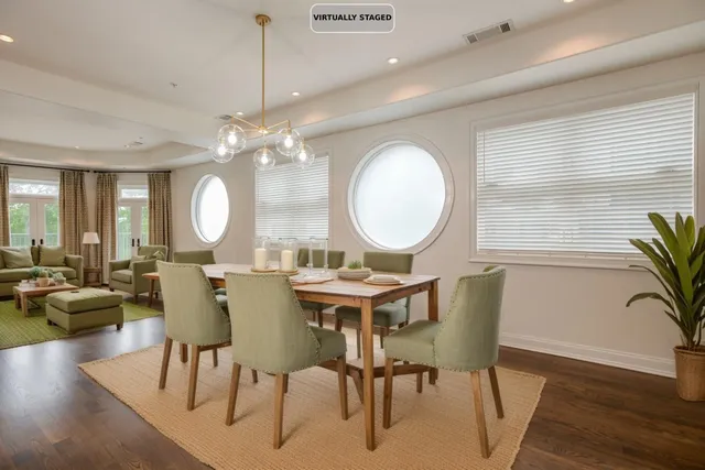 a view of a dining room with furniture window and wooden floor