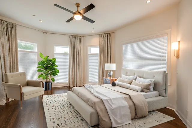 a bedroom with a balcony a bed and a couch