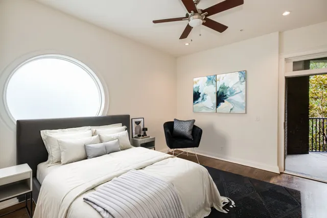 a bedroom with bed and window