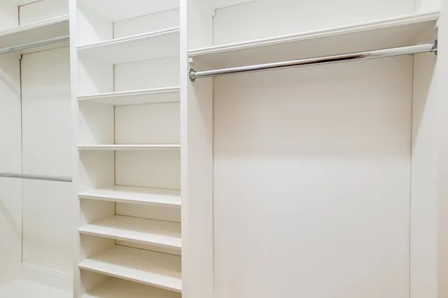 a view of an empty walk in closet