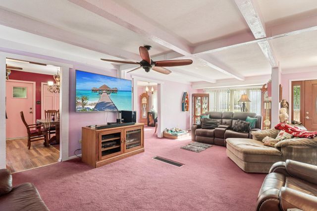 a kitchen with stainless steel appliances granite countertop a refrigerator sink and cabinets