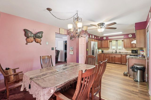 a kitchen with stainless steel appliances granite countertop a stove and a refrigerator