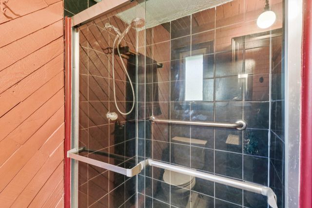 a living room with furniture a rug and a table