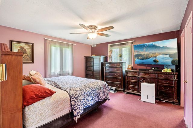 a dining room with furniture wooden floor and a potted plant