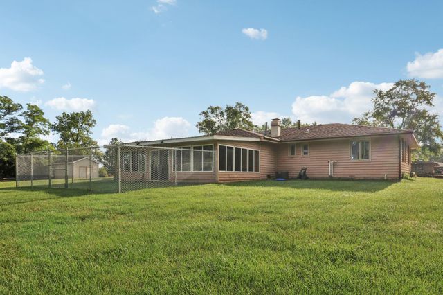 a backyard of a house with lots of green space