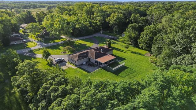 a backyard of a house with lots of green space