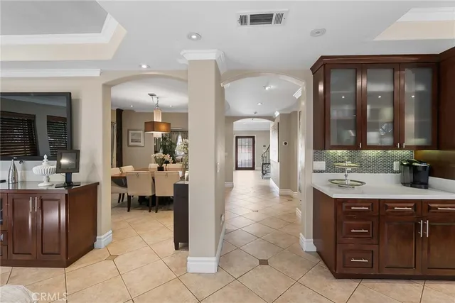 a view of a hallway with wooden floor and entryway