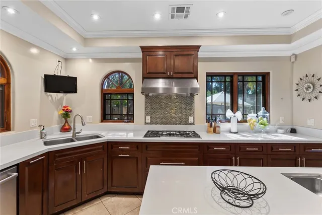 a bedroom with a bed a mirror and a window