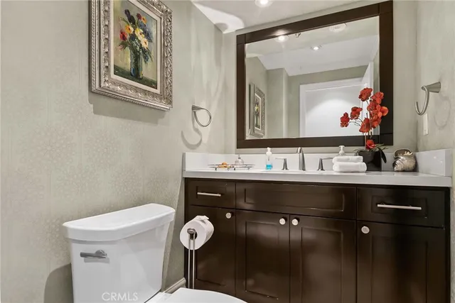 a view of a kitchen with furniture and wooden floor