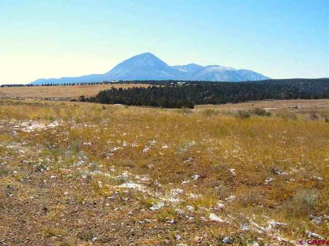 a view of an ocean and a mountain