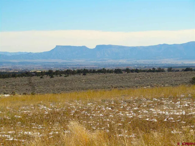 a view of an ocean and a mountain
