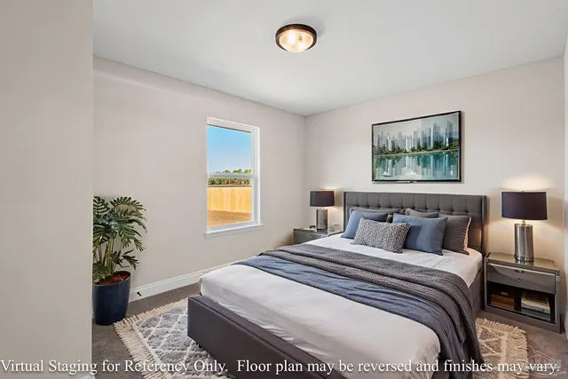 a view of an empty room with closet and a window