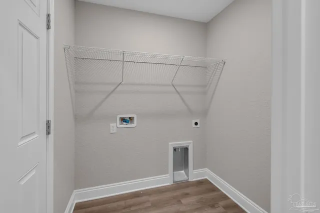 a view of a lake with houses in the back