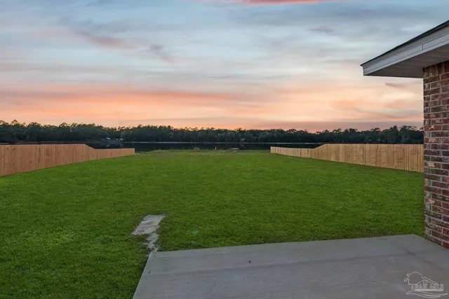 a view of a lake from a yard