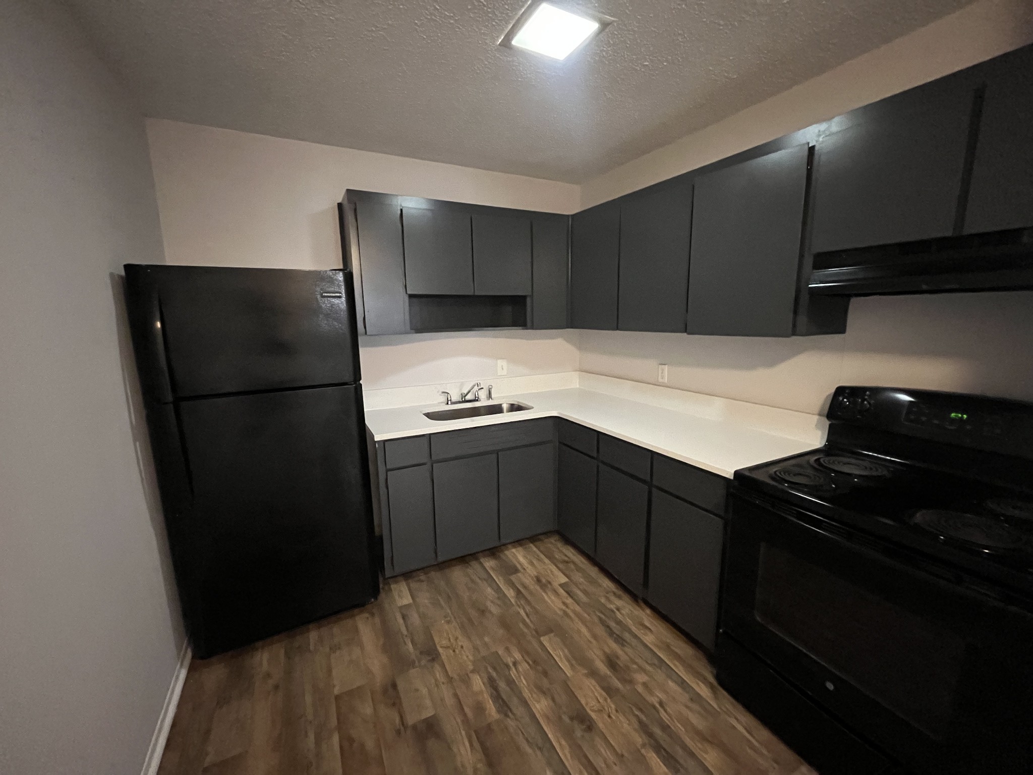 441 Harding Place, Unit E10 Nashville, TN 37211 - Photo 3 of 12 a kitchen with a refrigerator and a stove