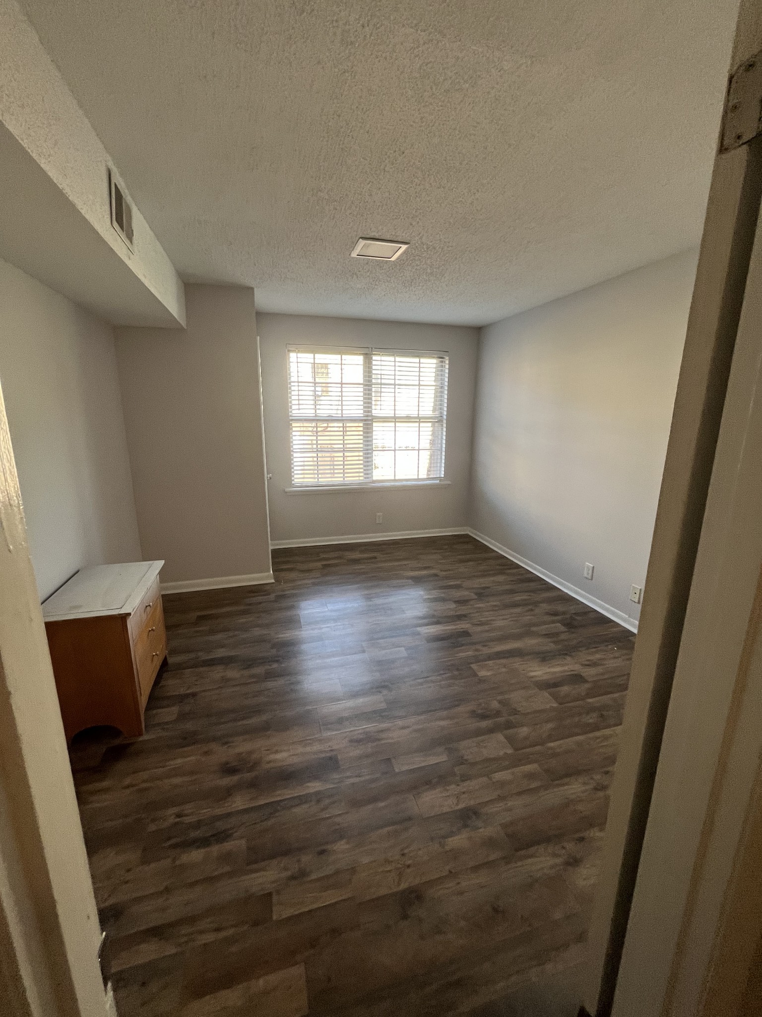 441 Harding Place, Unit E10 Nashville, TN 37211 - Photo 6 of 12 a view of room with window and wooden floor