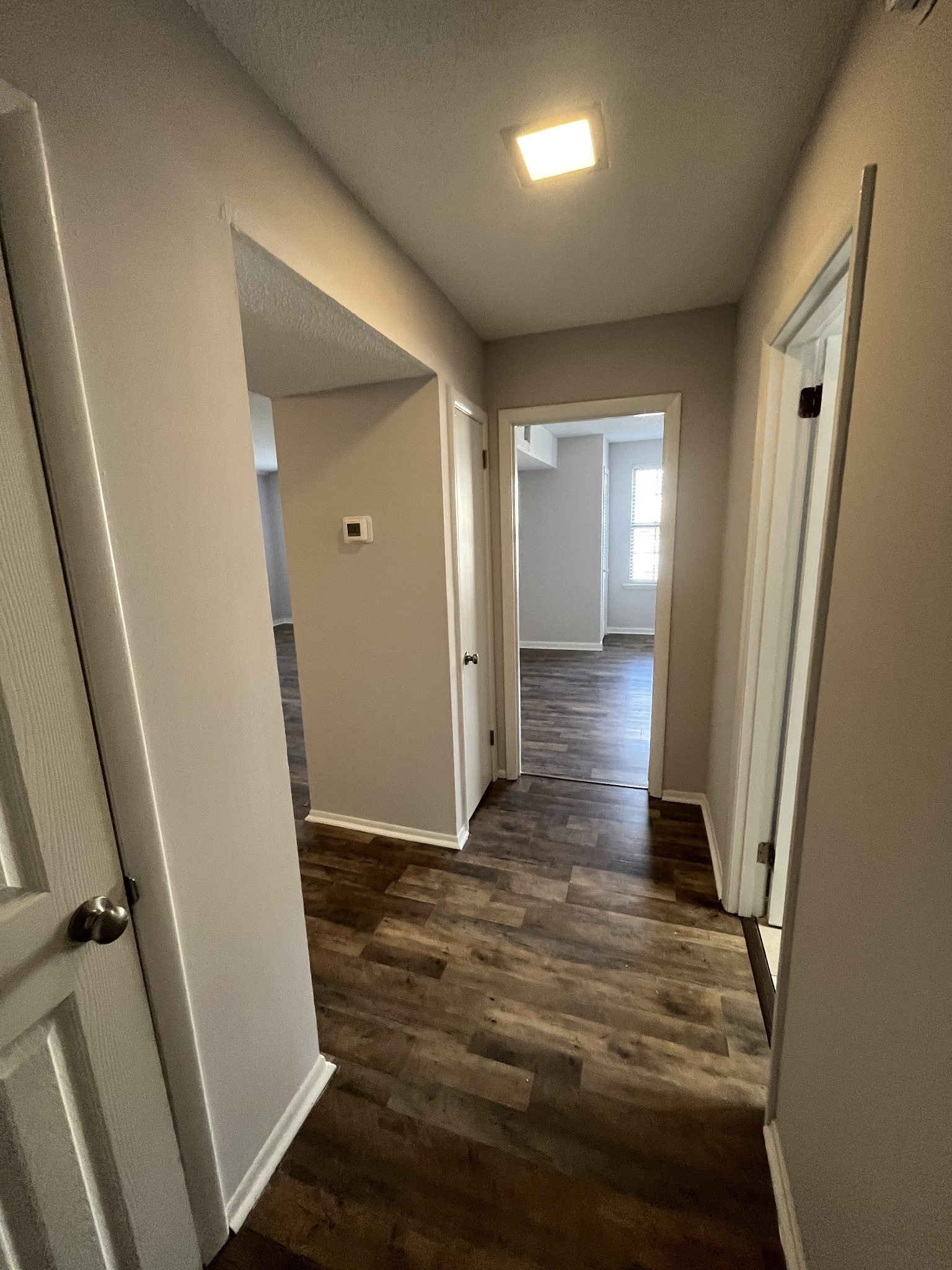 441 Harding Place, Unit E10 Nashville, TN 37211 - Photo 10 of 12 a view of a hallway with wooden floor and staircase