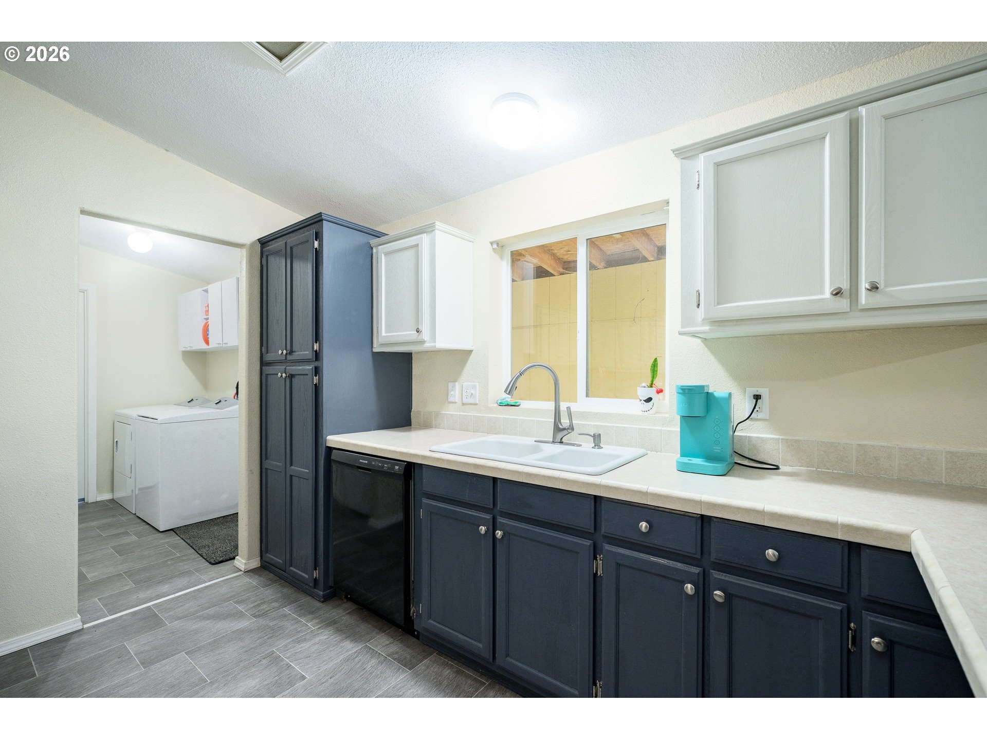 1282 3rd Street, Unit 83 Lafayette, OR 97127 - Photo 14 of 45 a kitchen with a sink and cabinets