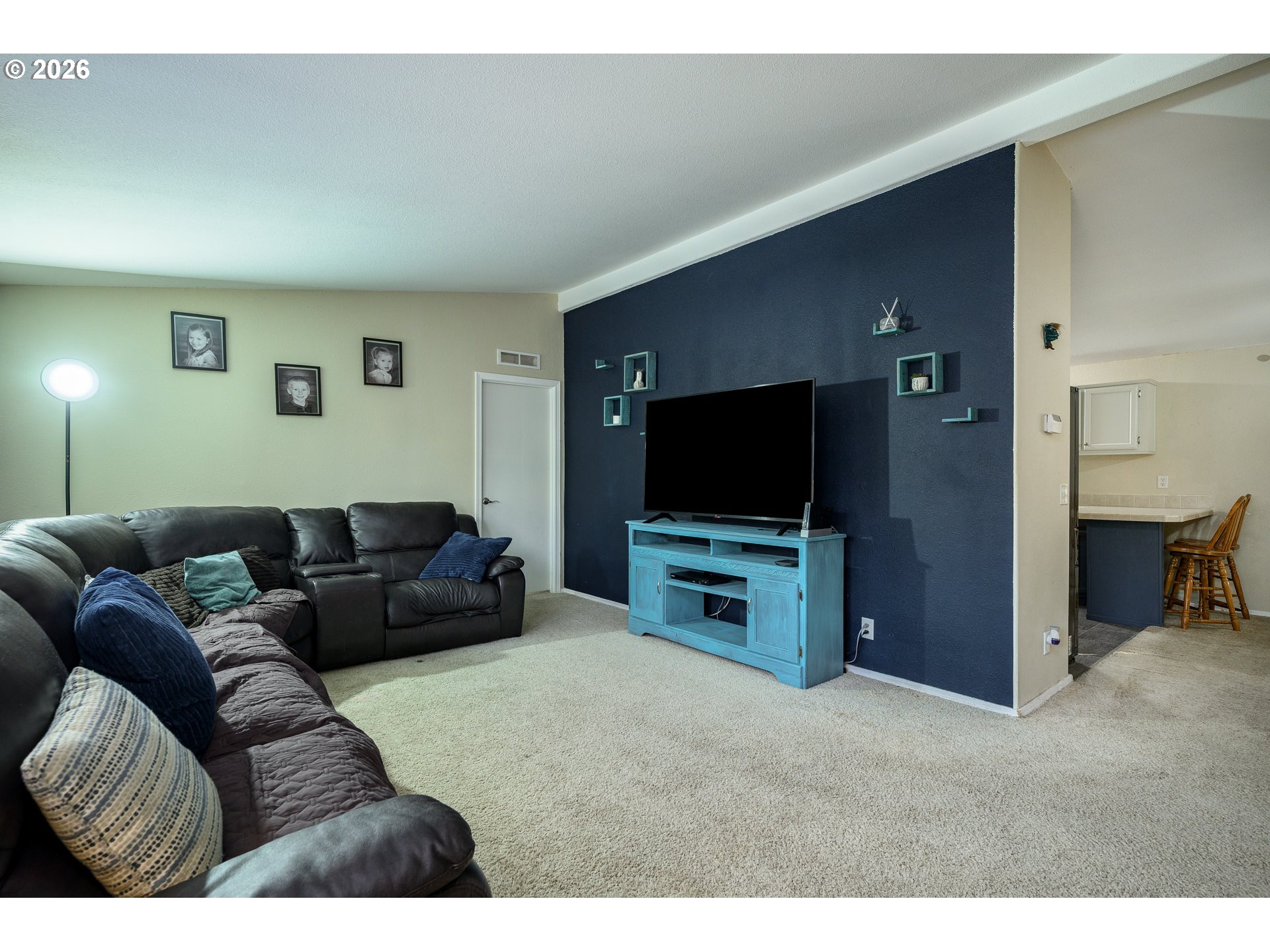 1282 3rd Street, Unit 83 Lafayette, OR 97127 - Photo 22 of 45 a living room with furniture and a flat screen tv