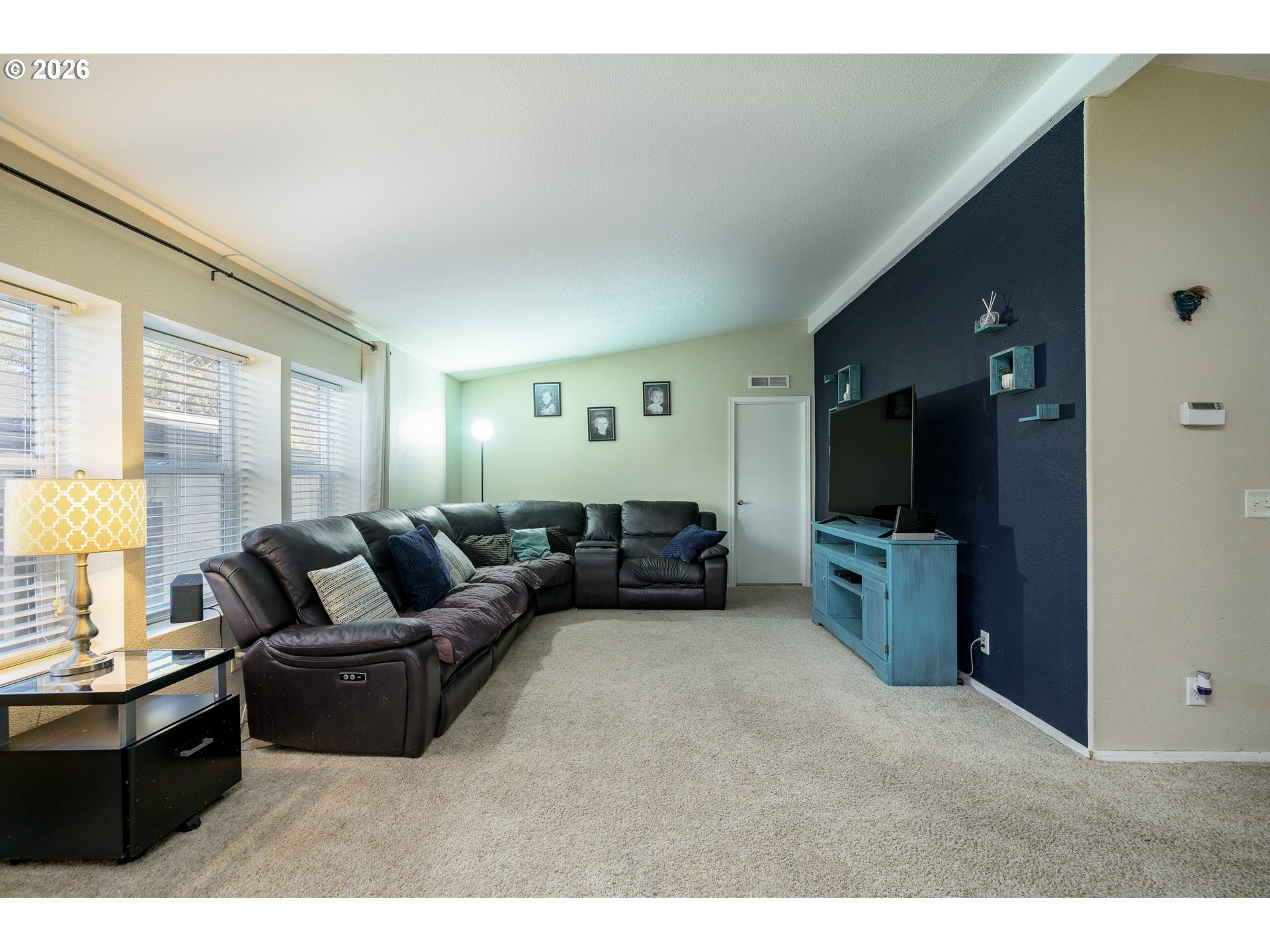 1282 3rd Street, Unit 83 Lafayette, OR 97127 - Photo 23 of 45 a living room with furniture and a flat screen tv