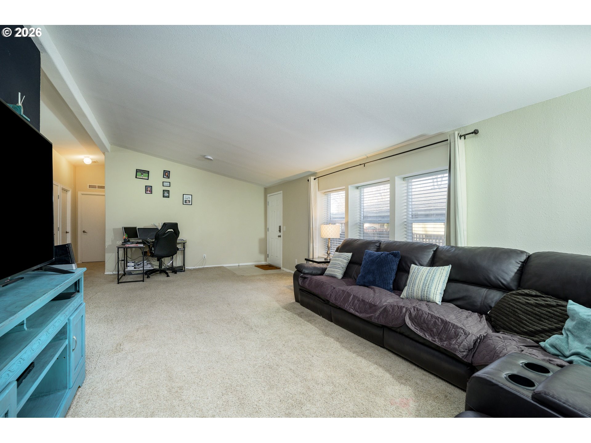 1282 3rd Street, Unit 83 Lafayette, OR 97127 - Photo 25 of 45 a living room with furniture and a flat screen tv