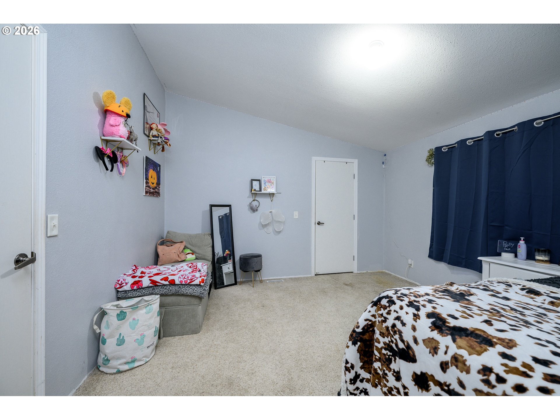 1282 3rd Street, Unit 83 Lafayette, OR 97127 - Photo 28 of 45 a bedroom with a bed and cabinets