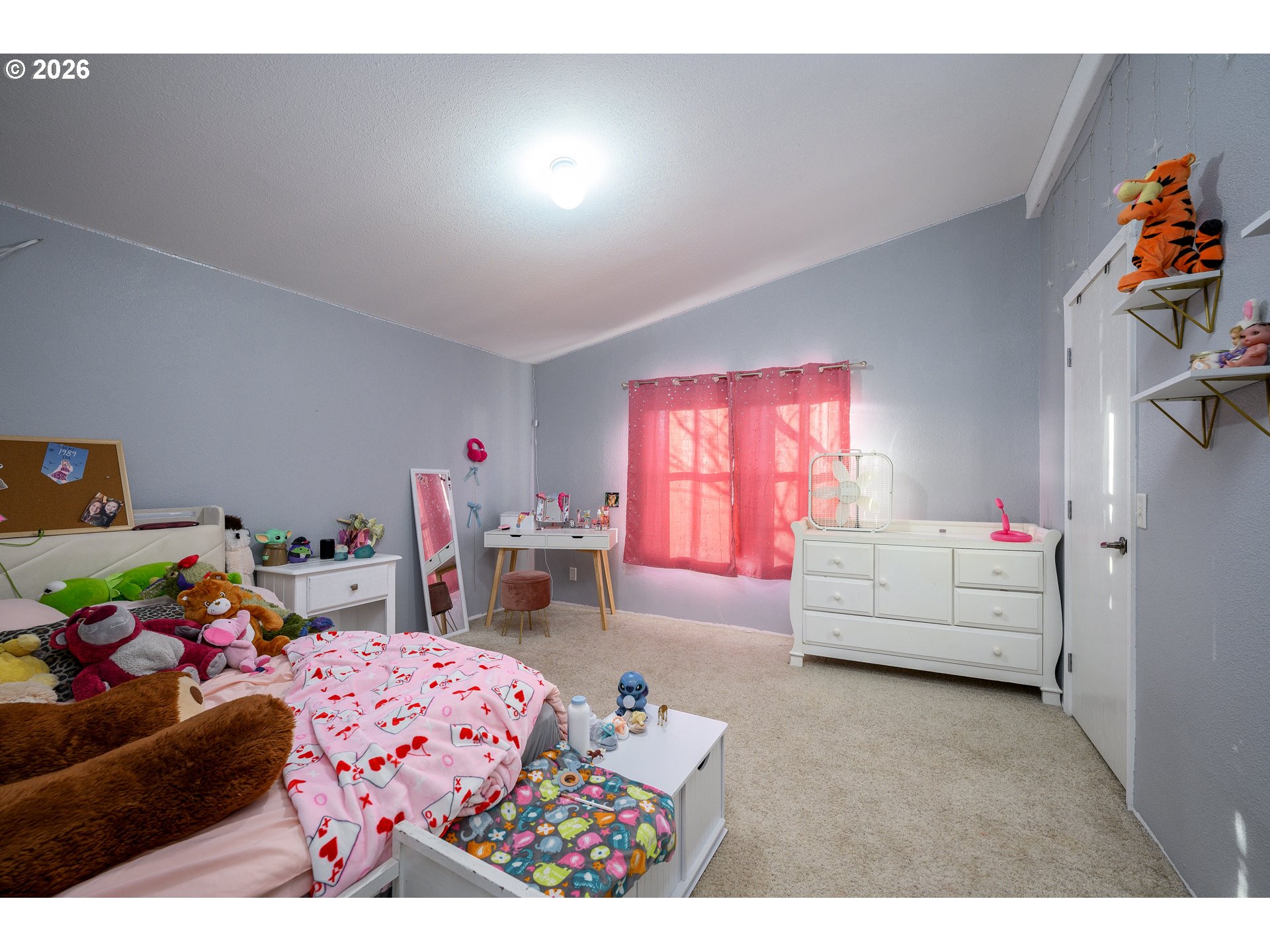 1282 3rd Street, Unit 83 Lafayette, OR 97127 - Photo 30 of 45 a bedroom with furniture and a bed