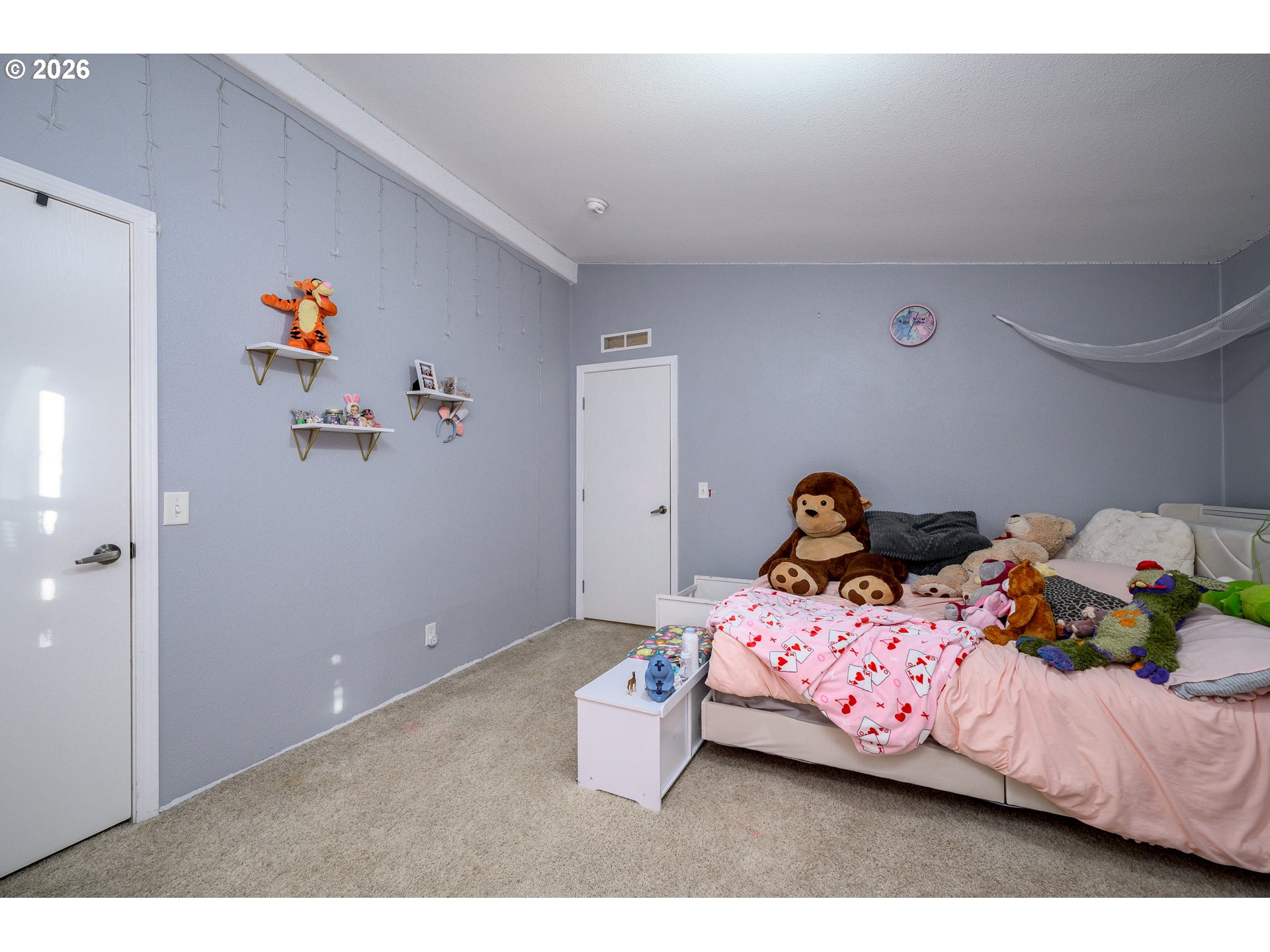 1282 3rd Street, Unit 83 Lafayette, OR 97127 - Photo 31 of 45 a bedroom with a bed and cabinets