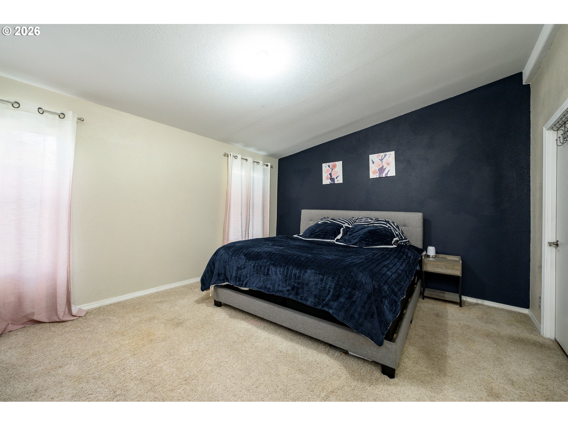 1282 3rd Street, Unit 83 Lafayette, OR 97127 - Photo 34 of 45 a spacious bedroom with a bed and a window