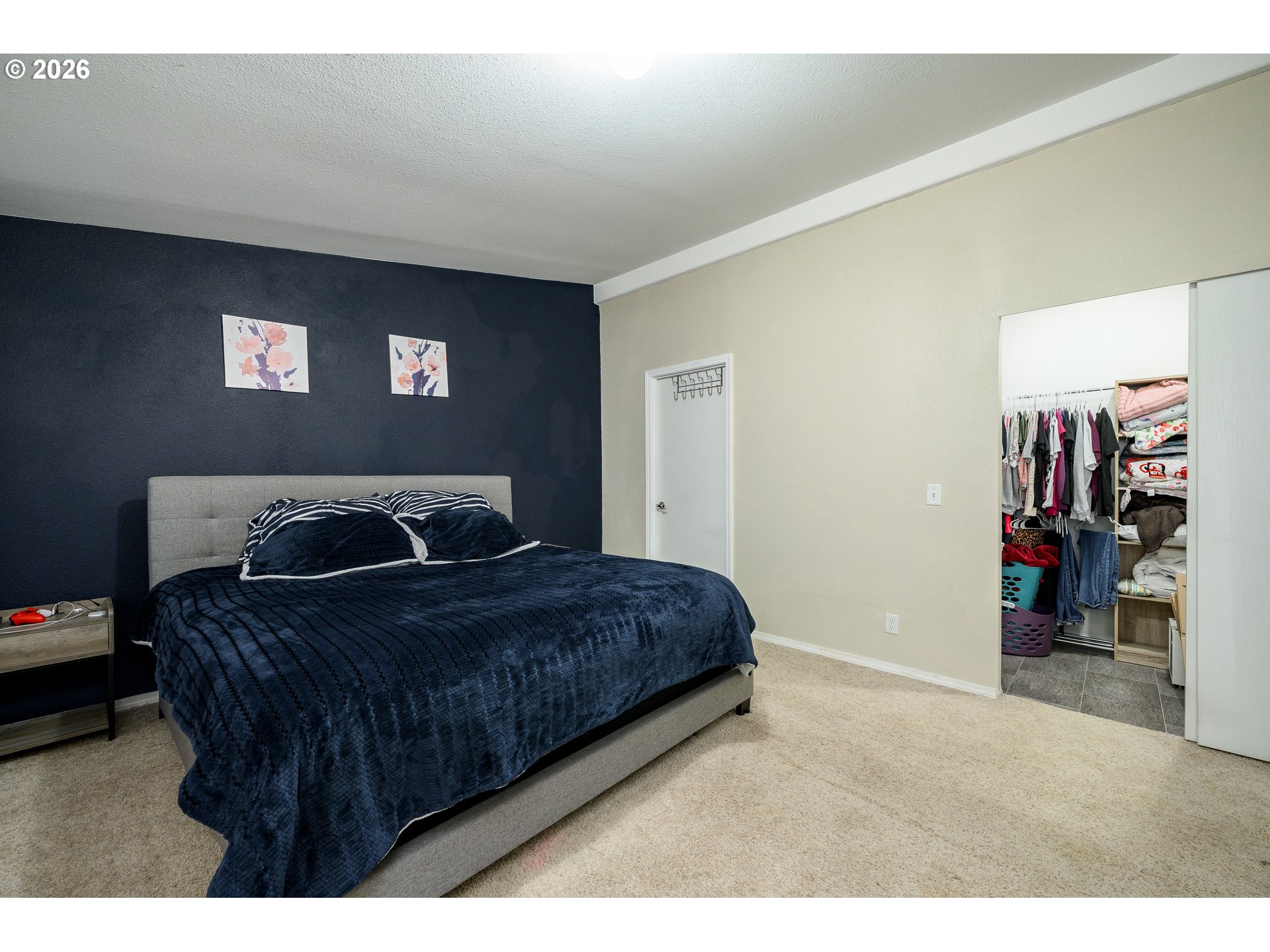 1282 3rd Street, Unit 83 Lafayette, OR 97127 - Photo 35 of 45 a bedroom with a bed and a television