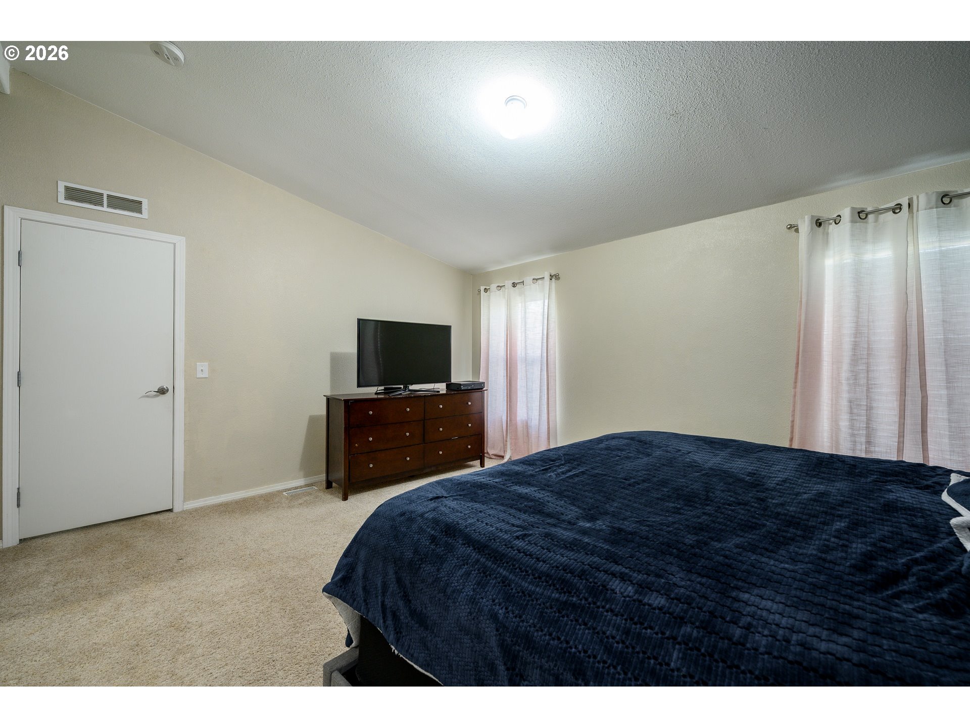 1282 3rd Street, Unit 83 Lafayette, OR 97127 - Photo 36 of 45 a bedroom with a bed and a television