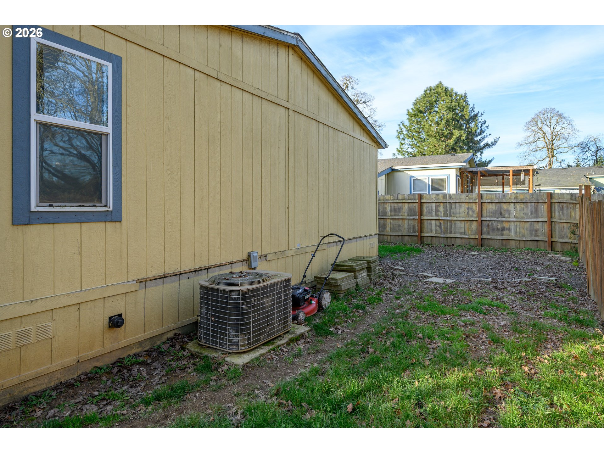 1282 3rd Street, Unit 83 Lafayette, OR 97127 - Photo 43 of 45 a backyard of a house with wooden fence and a bench