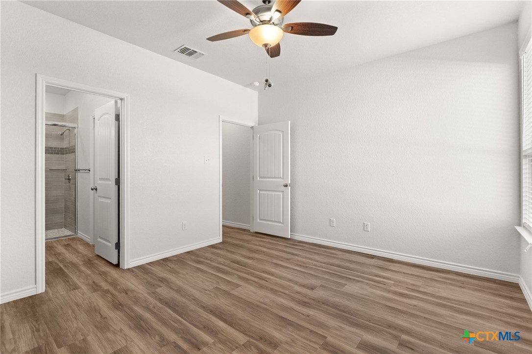 102 Levi Court, Unit B Copperas Cove, TX 76522 - Photo 6 of 9 a view of an empty room with wooden floor