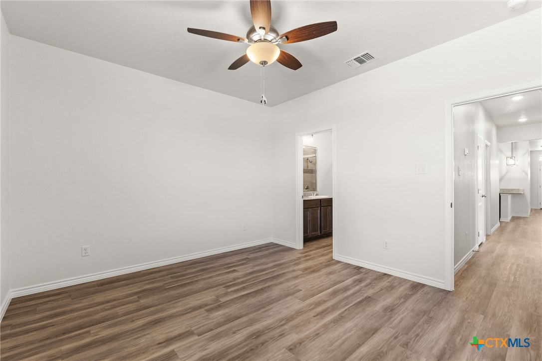 102 Levi Court, Unit B Copperas Cove, TX 76522 - Photo 9 of 9 wooden floor in an empty room