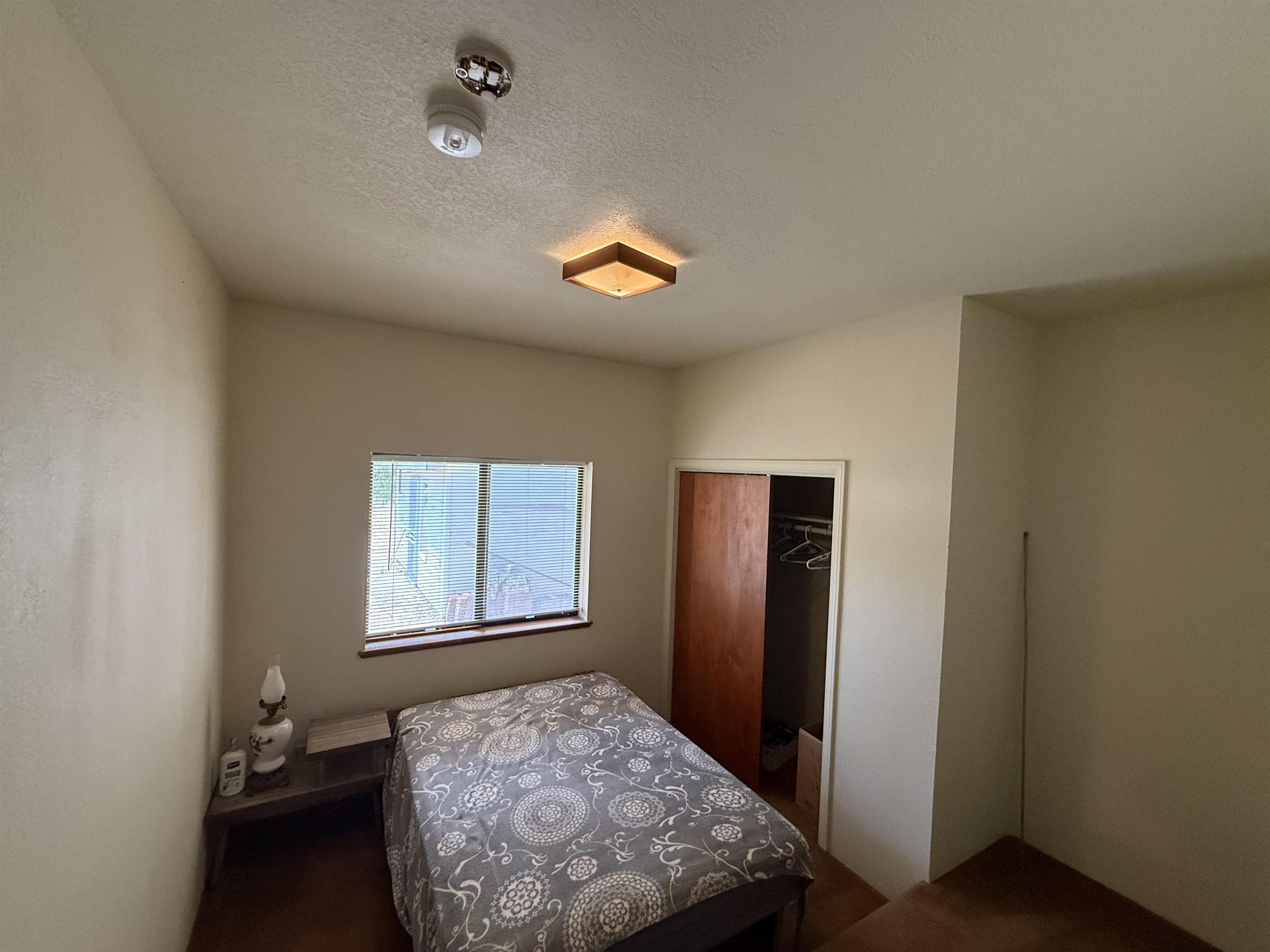 5893 Fruitland Road Marysville, CA 95901 - Photo 16 of 35 a bedroom with a bed and a window