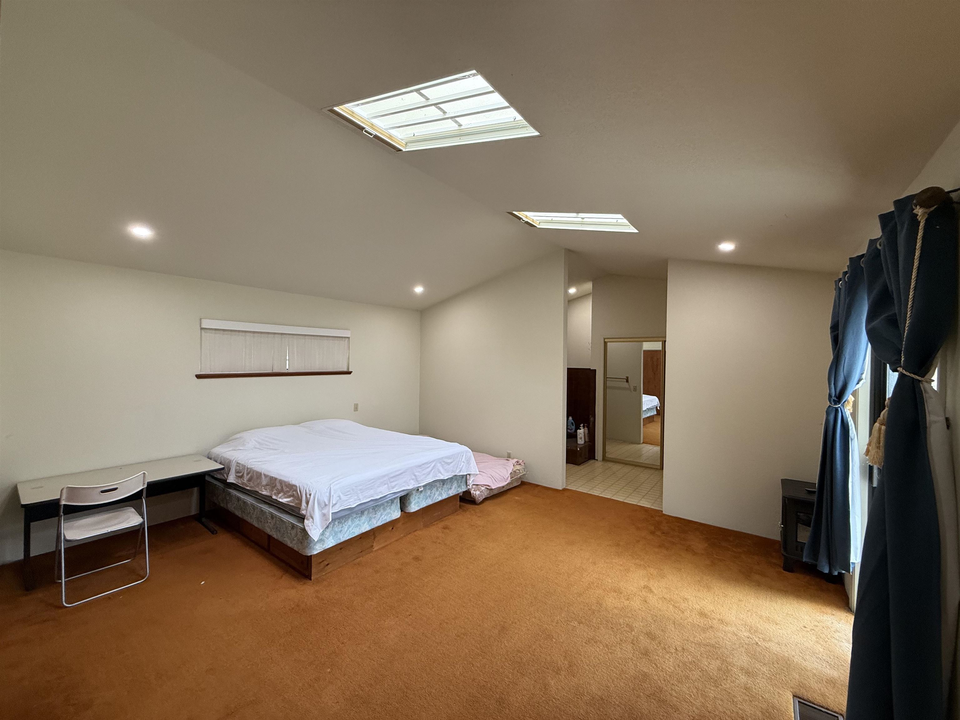 5893 Fruitland Road Marysville, CA 95901 - Photo 18 of 35 a bedroom with bed and a chandelier