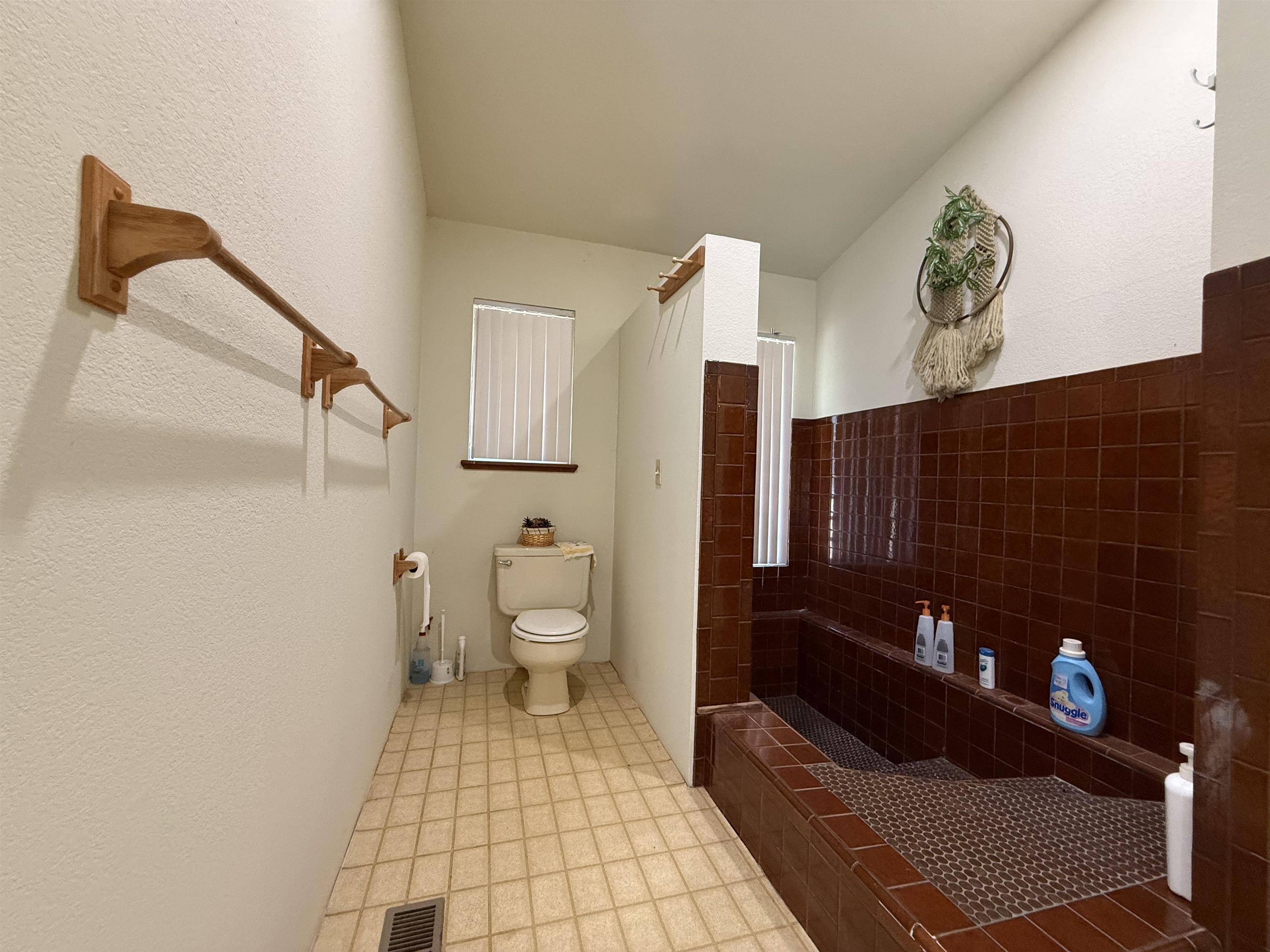 5893 Fruitland Road Marysville, CA 95901 - Photo 20 of 35 a bathroom with a toilet and a shower