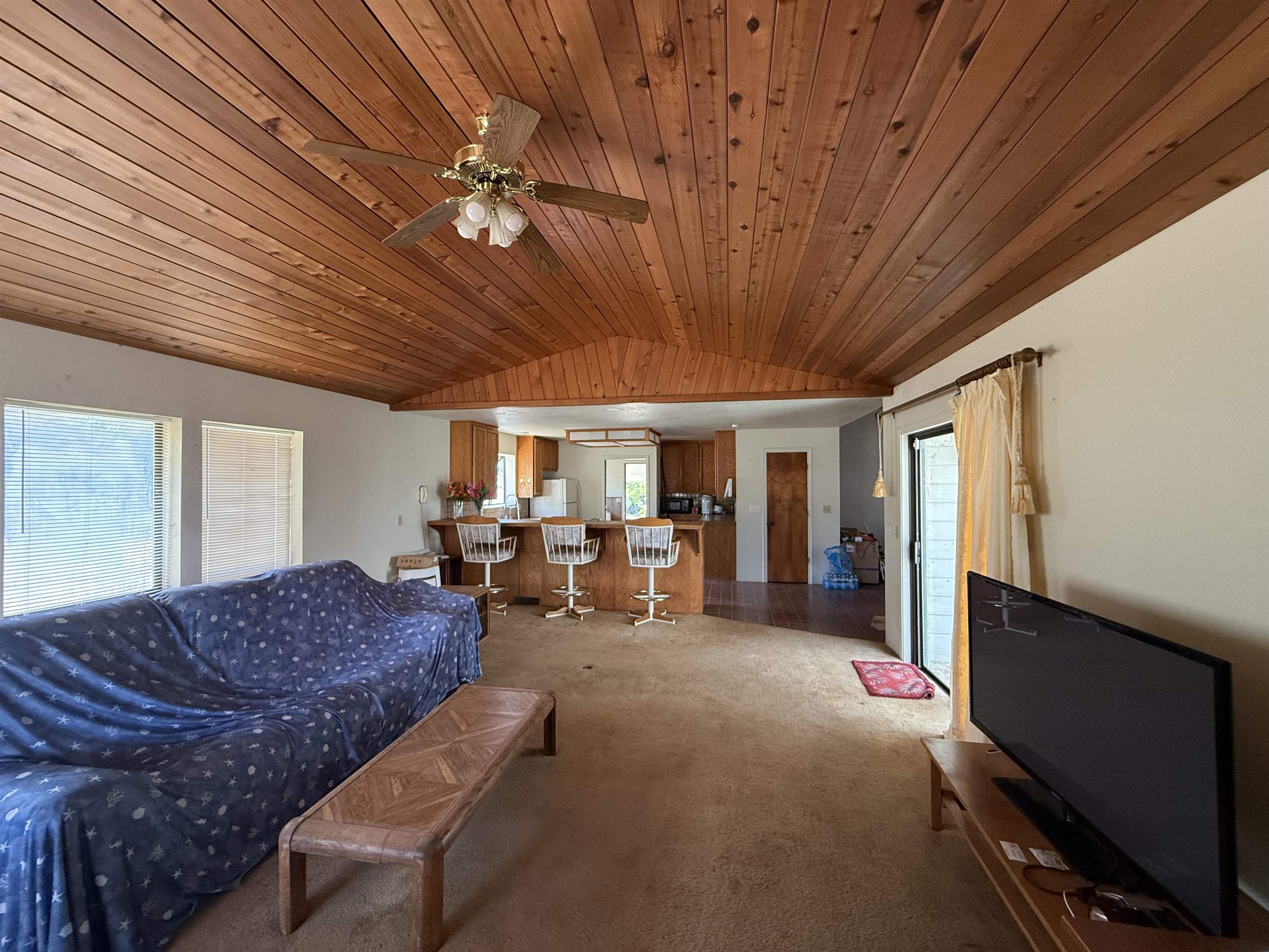 5893 Fruitland Road Marysville, CA 95901 - Photo 10 of 35 a living room with furniture a ceiling fan and a window