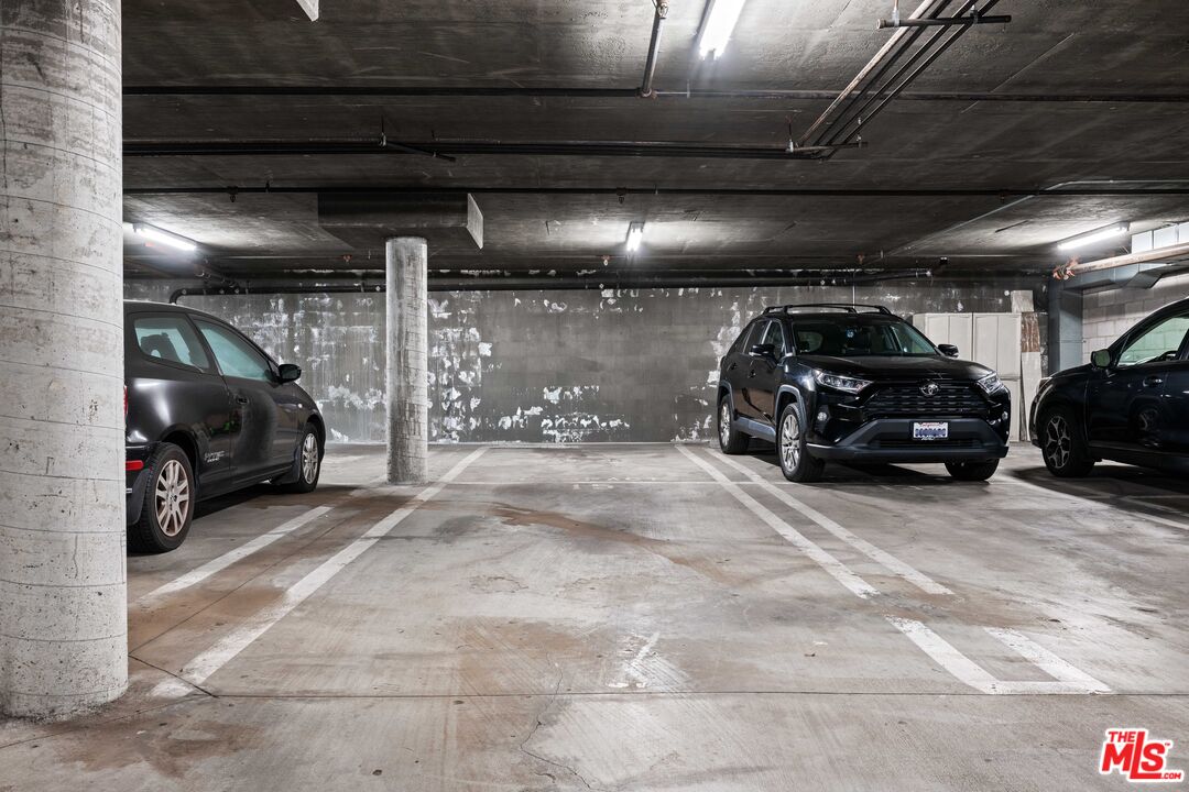 1401 South Bentley Avenue, Unit 202 Los Angeles, CA 90025 - Photo 28 of 32 a car parked in a garage