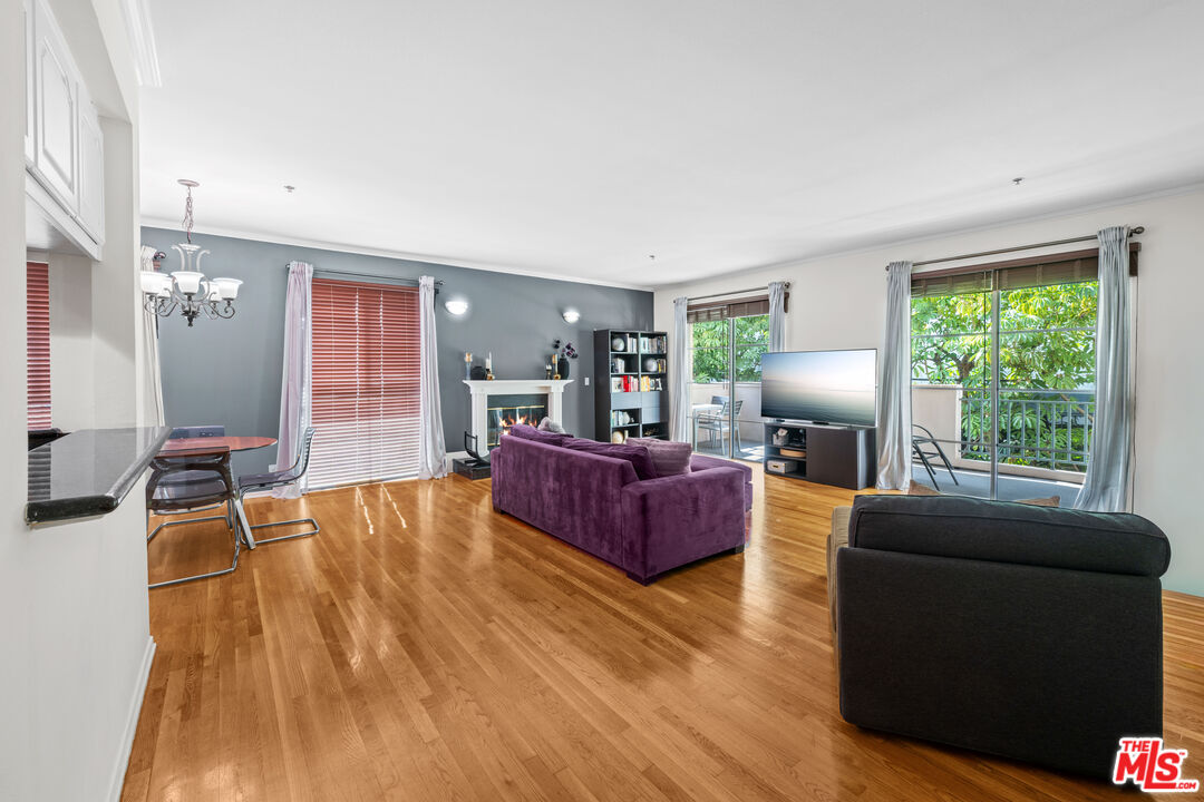 1401 South Bentley Avenue, Unit 202 Los Angeles, CA 90025 - Photo 6 of 32 a living room with furniture and a wooden floor