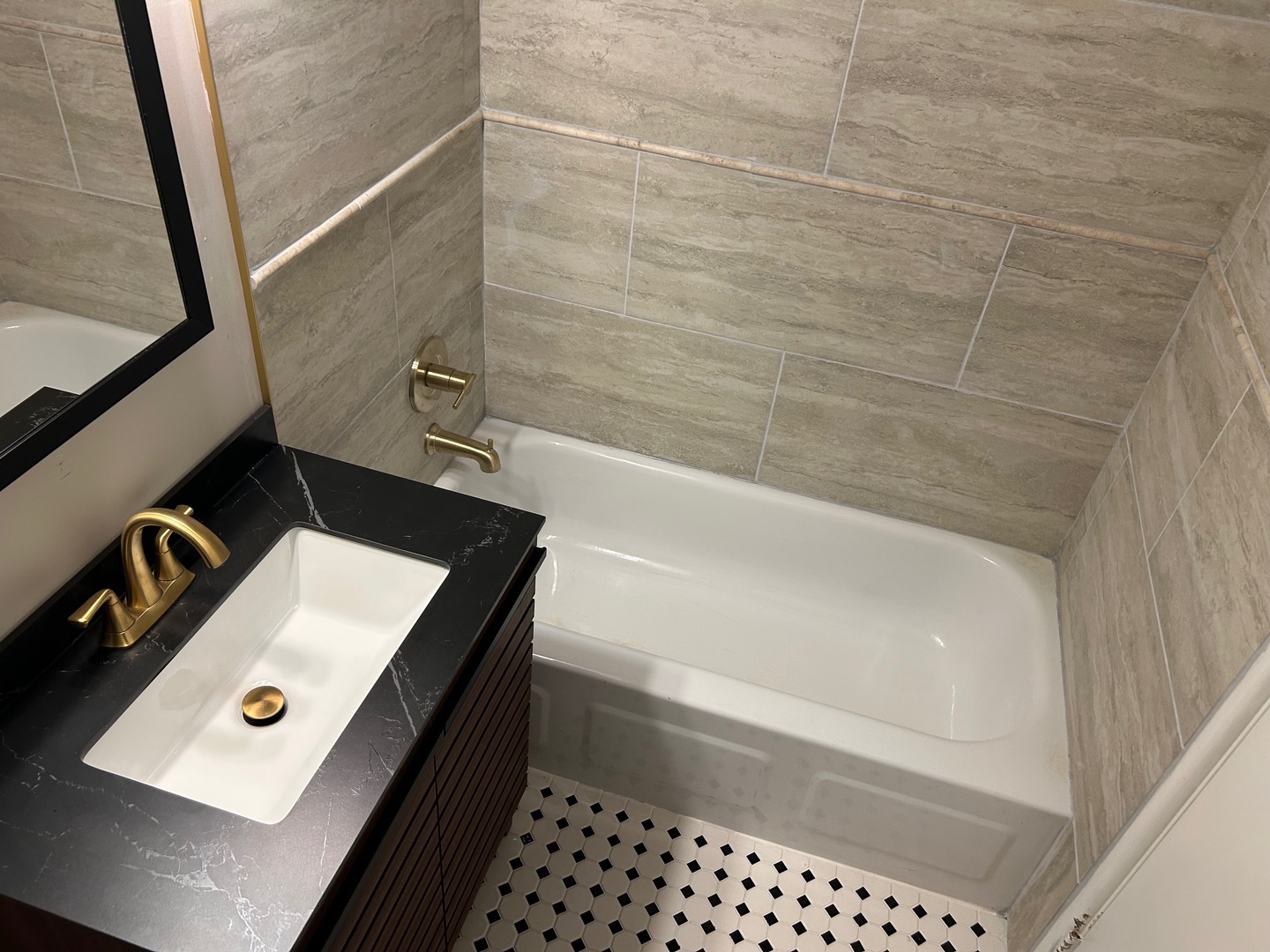 9724 Bianco Terrace, Unit A Des Plaines, IL 60016 - Photo 12 of 13 a bathroom with a sink a toilet and bathtub