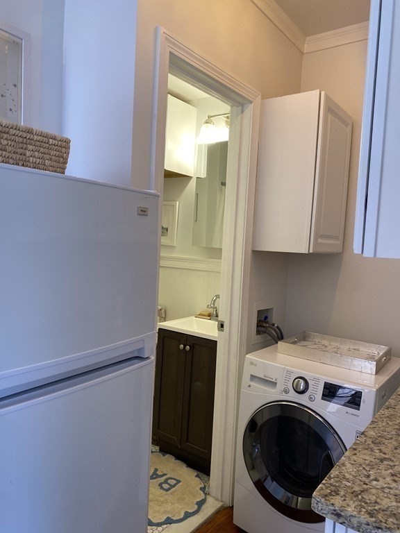 552 Tremont Street, Unit 2F Boston, MA 02118 - Photo 5 of 5 a utility room with dryer and washer