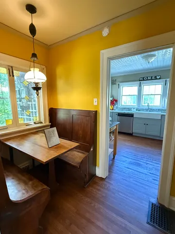 a spacious bathroom with a granite countertop sink and a window