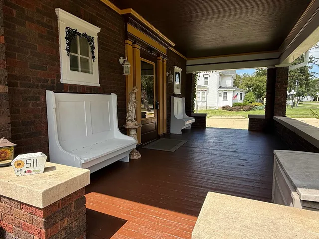 a view of a porch and garden