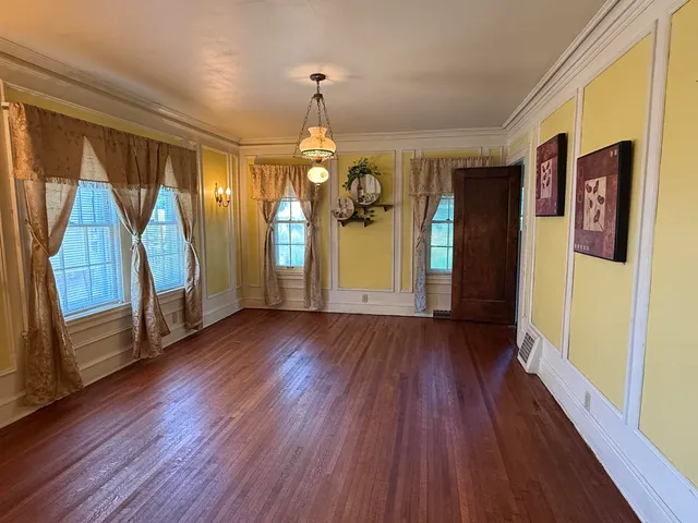 a view of entryway with wooden floor and stairs