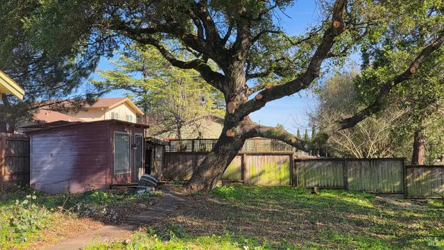 a backyard of a house with lots of green space