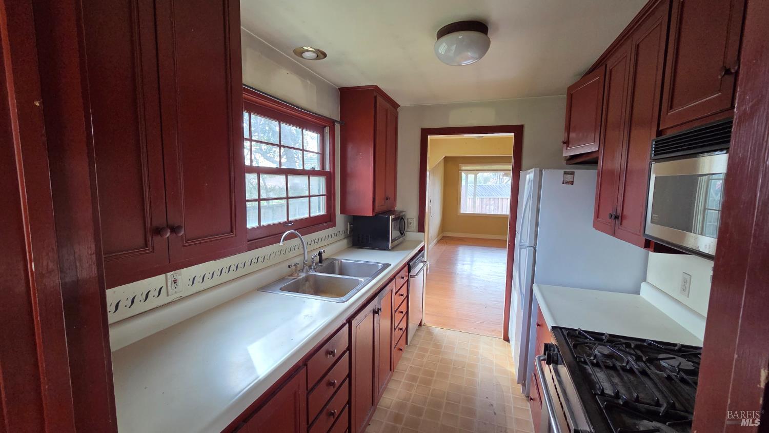 1420 Fulton Road Santa Rosa, CA 95403 - Photo 6 of 17 a kitchen with a refrigerator and a sink
